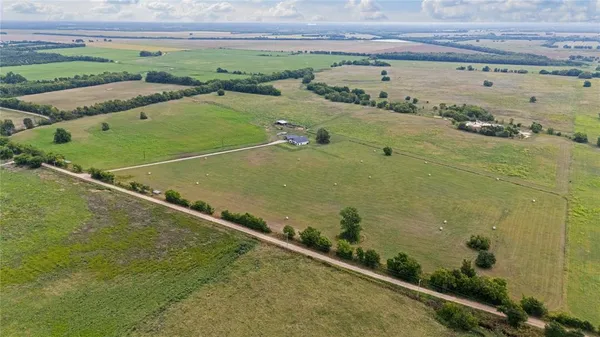 a view of a swimming pool and an outdoor space