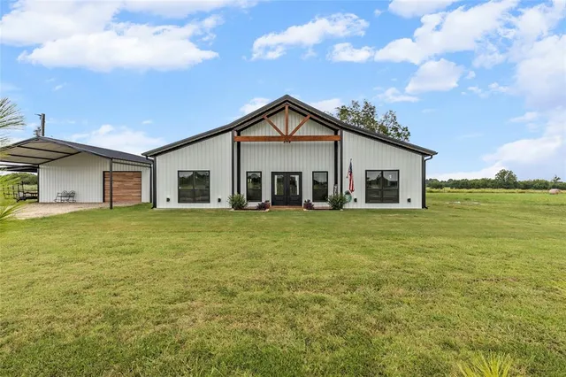 a front view of house with an outdoor space and seating