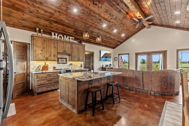 a kitchen with lots of counter top space and appliances