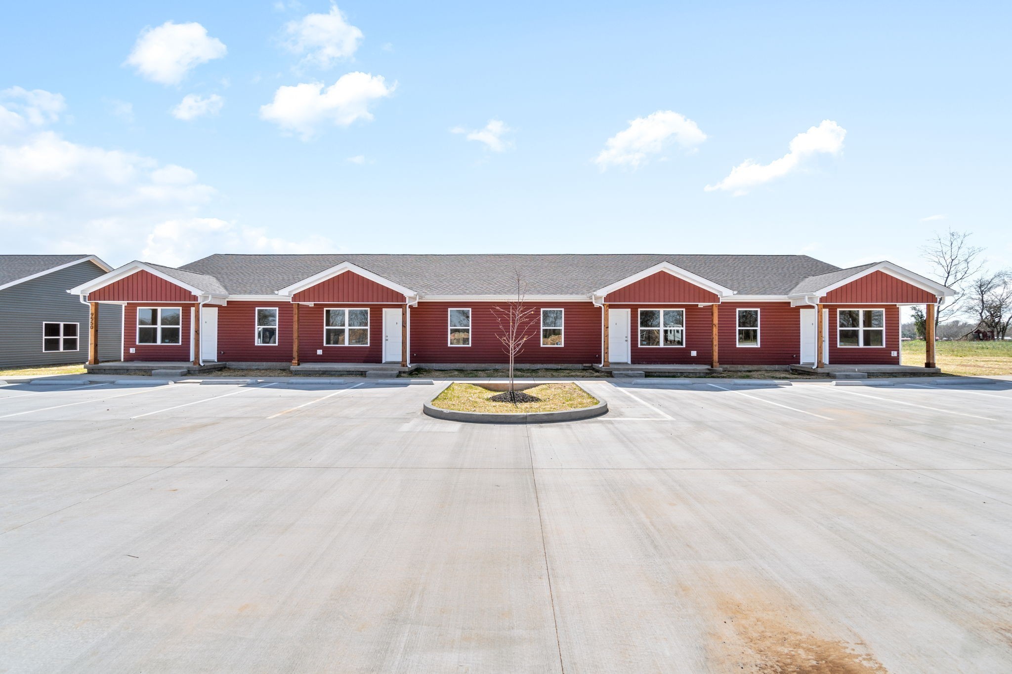 9550 Russellville Road, Unit C Guthrie, KY 42234 - Photo 1 of 23 a front view of a house with swimming pool and porch