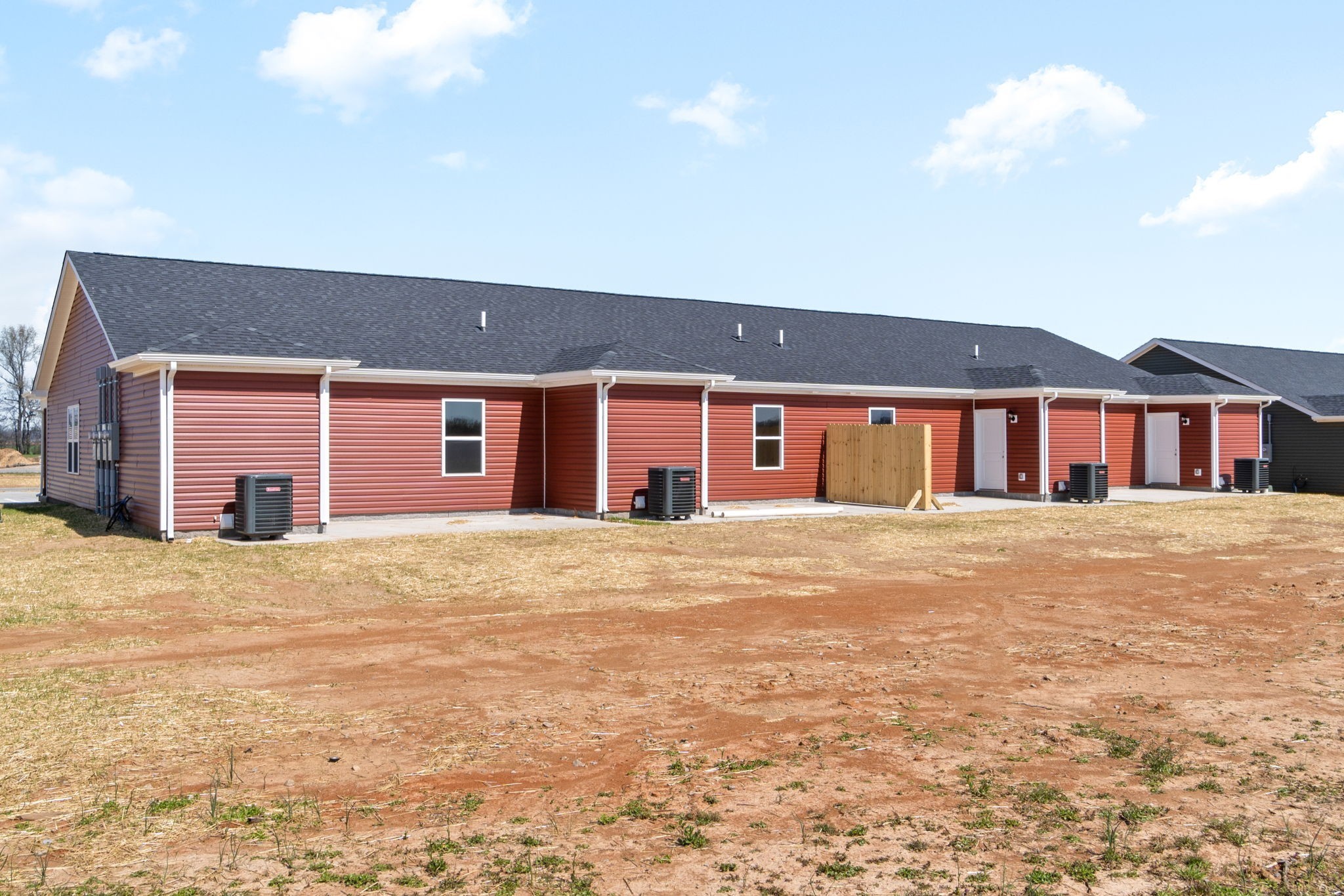 9550 Russellville Road, Unit C Guthrie, KY 42234 - Photo 21 of 23 a front view of a house with a yard and garage