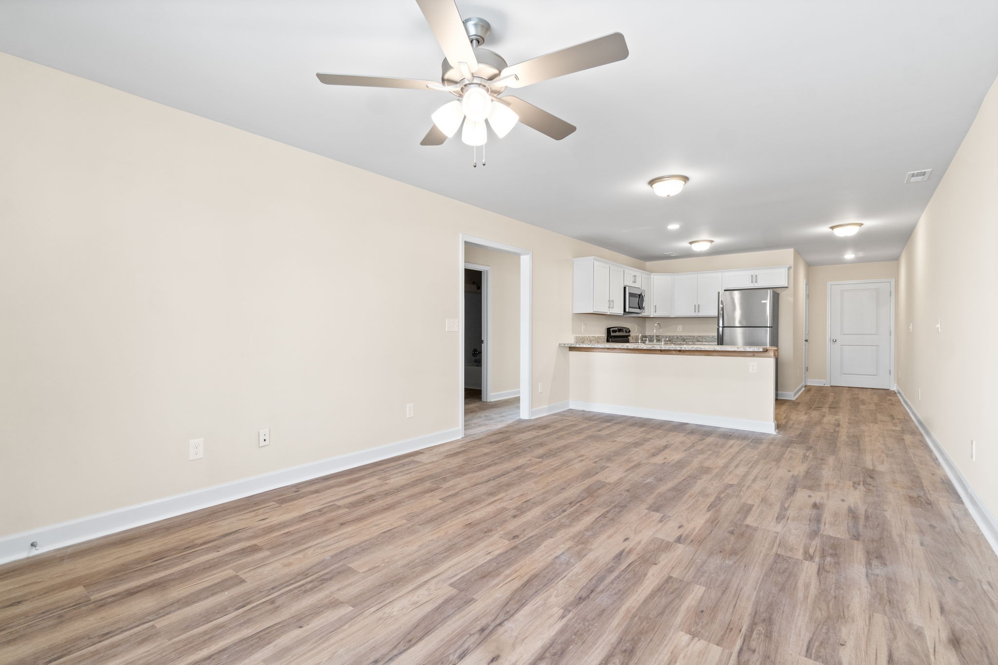 9550 Russellville Road, Unit C Guthrie, KY 42234 - Photo 3 of 23 a view of kitchen with wooden floor and window