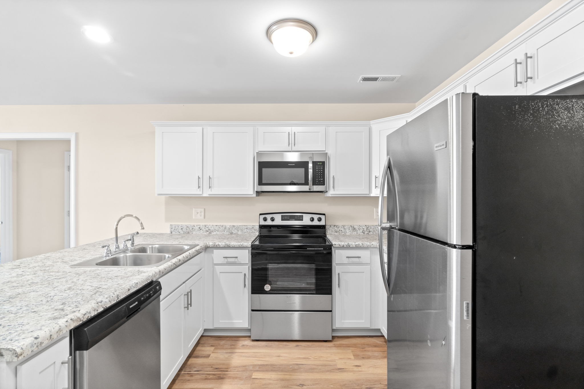 9550 Russellville Road, Unit C Guthrie, KY 42234 - Photo 6 of 23 a kitchen with a refrigerator and a sink
