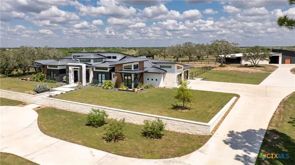 a view of a swimming pool with a yard