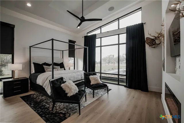 a living room with furniture a piano and a fireplace