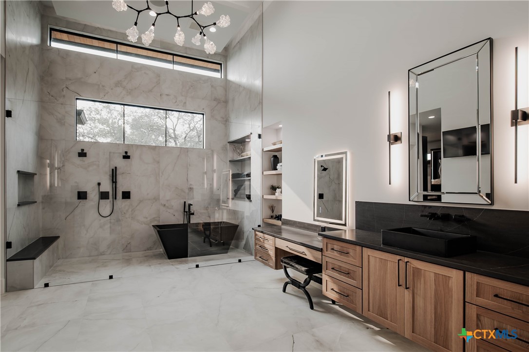 3466 Levi Sloan Road Victoria, TX 77904 - Photo 17 of 48 a large kitchen with cabinets a sink and stainless steel appliances