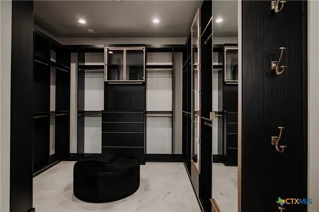 a very nice looking living room with a large window and a rug