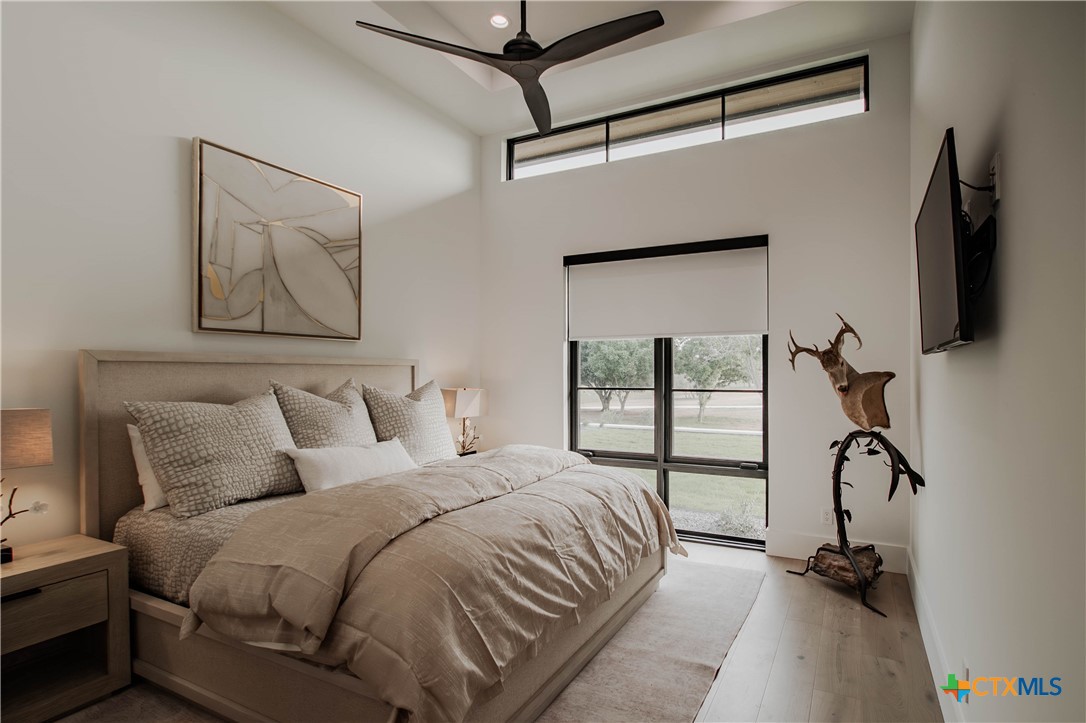 3466 Levi Sloan Road Victoria, TX 77904 - Photo 23 of 48 a bedroom with a bed and a flat tv screen on the dresser