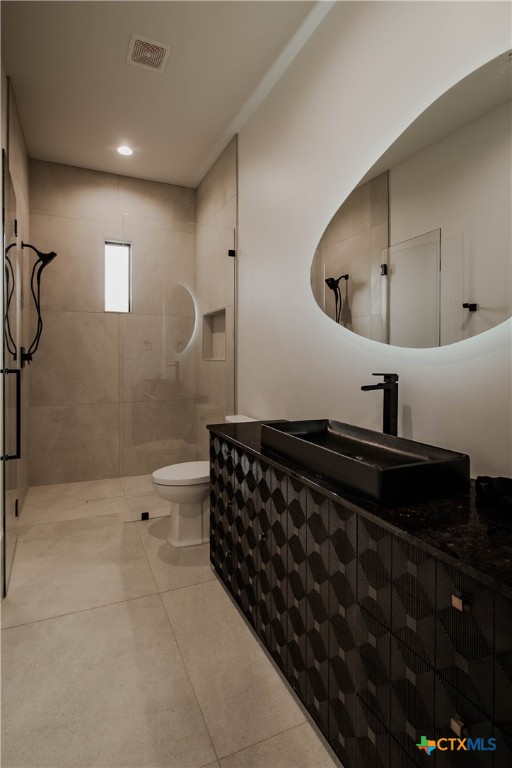 3466 Levi Sloan Road Victoria, TX 77904 - Photo 24 of 48 a bathroom with a sink a toilet and shower