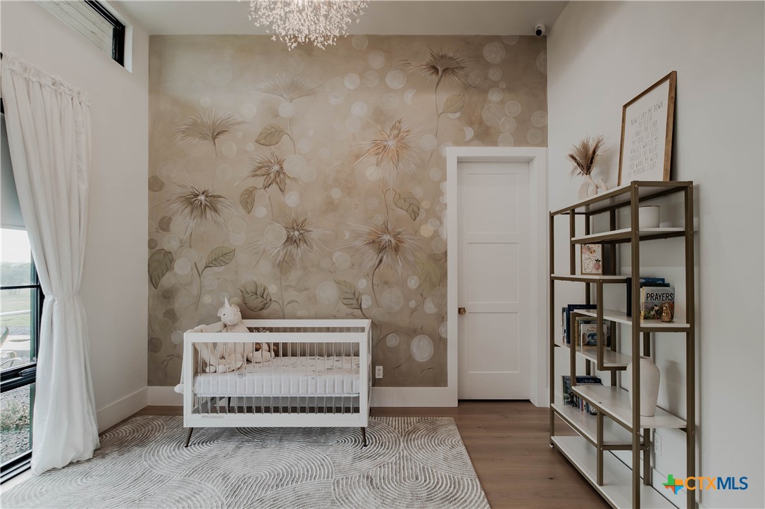 3466 Levi Sloan Road Victoria, TX 77904 - Photo 25 of 48 a bedroom with a bed and a book shelf