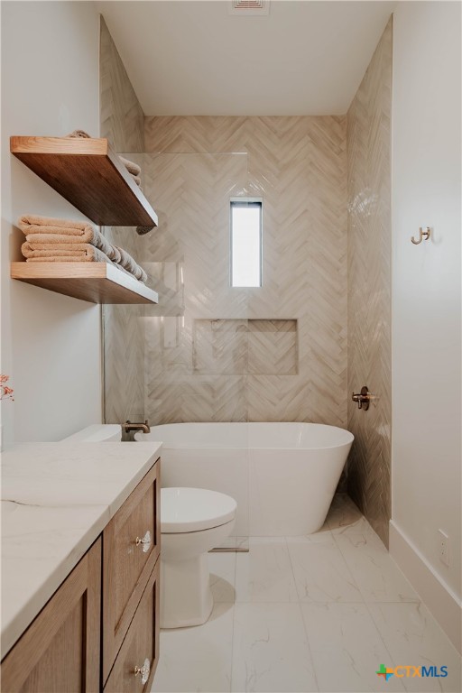 3466 Levi Sloan Road Victoria, TX 77904 - Photo 27 of 48 a bathroom with a sink a toilet and shower