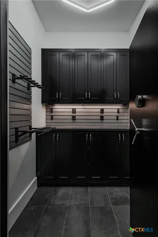 a view of a house with pool and sitting area