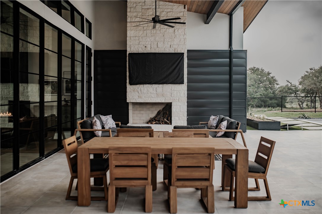 3466 Levi Sloan Road Victoria, TX 77904 - Photo 35 of 48 a view of a dinning tables and chairs in the patio