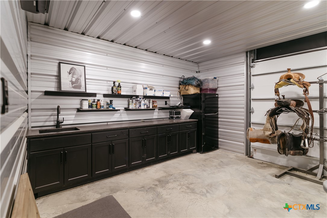 3466 Levi Sloan Road Victoria, TX 77904 - Photo 42 of 48 a kitchen with stainless steel appliances granite countertop a sink and cabinets