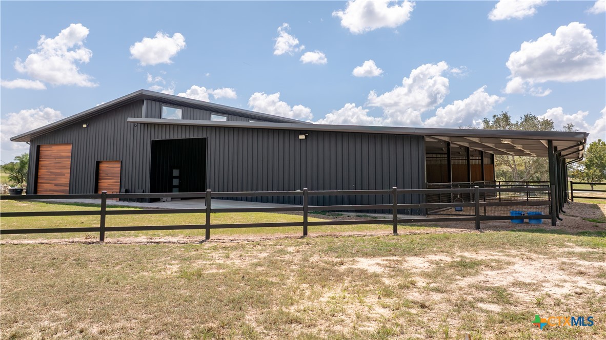 3466 Levi Sloan Road Victoria, TX 77904 - Photo 45 of 48 a view of a house with backyard and a chair