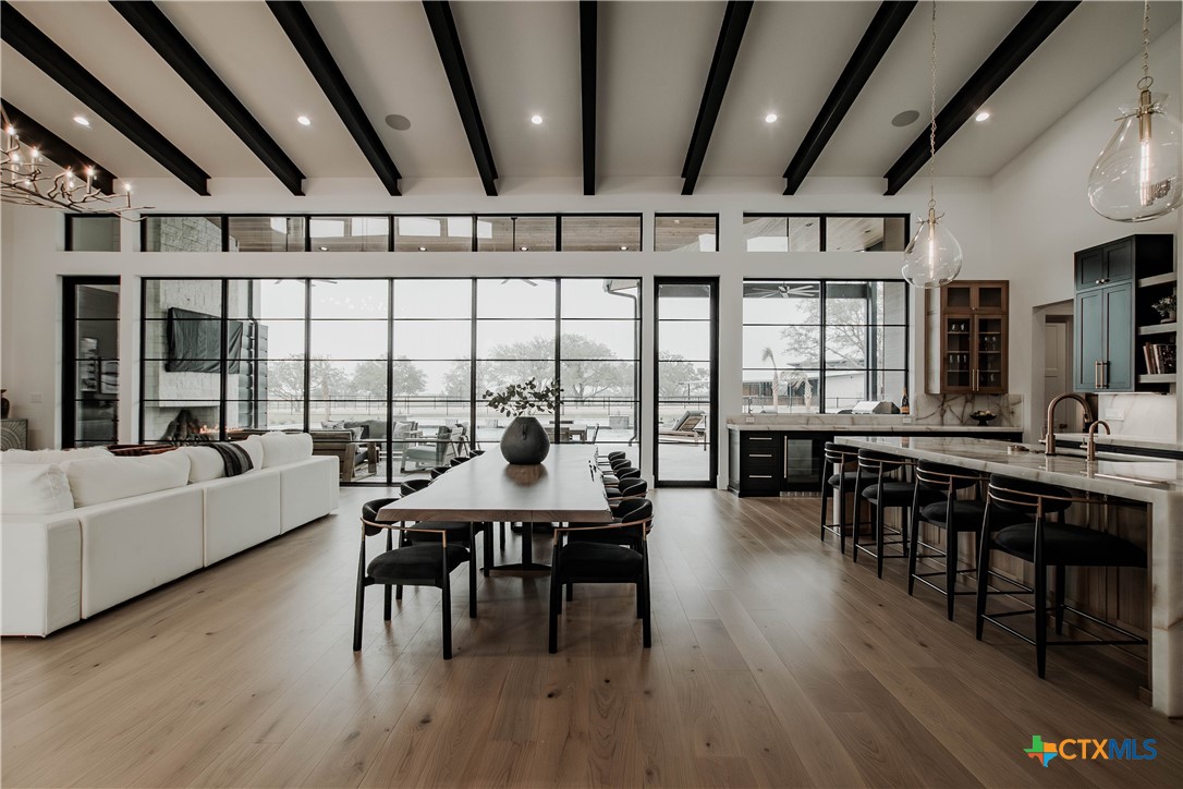 3466 Levi Sloan Road Victoria, TX 77904 - Photo 7 of 48 a view of a dining room with furniture window and wooden floor