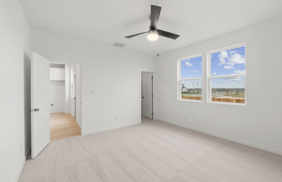 404 Sullivan Way Elgin, TX 78621 - Photo 13 of 23 a view of an empty room with a window