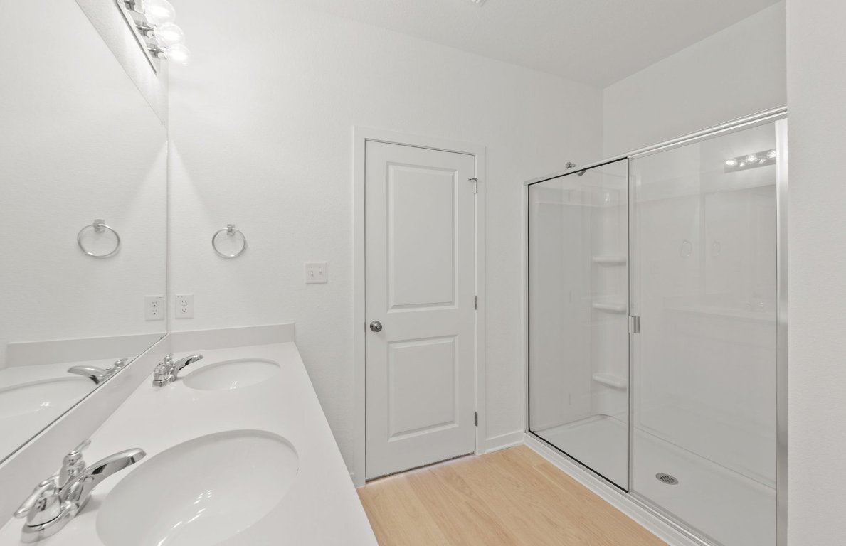 404 Sullivan Way Elgin, TX 78621 - Photo 17 of 23 a bathroom with a sink and shower