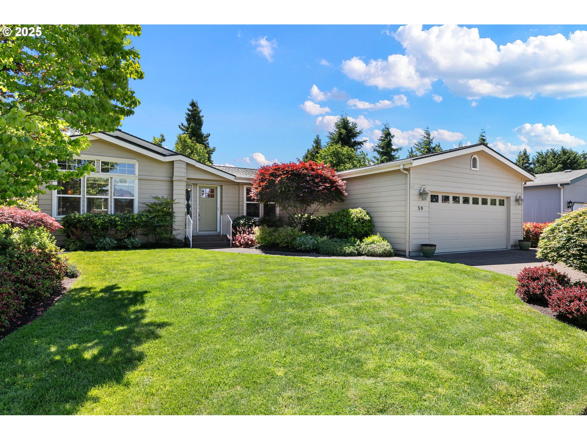 3220 Crescent Avenue, Unit 59 Eugene, OR 97408 - Photo 1 of 43 a front view of a house with garden