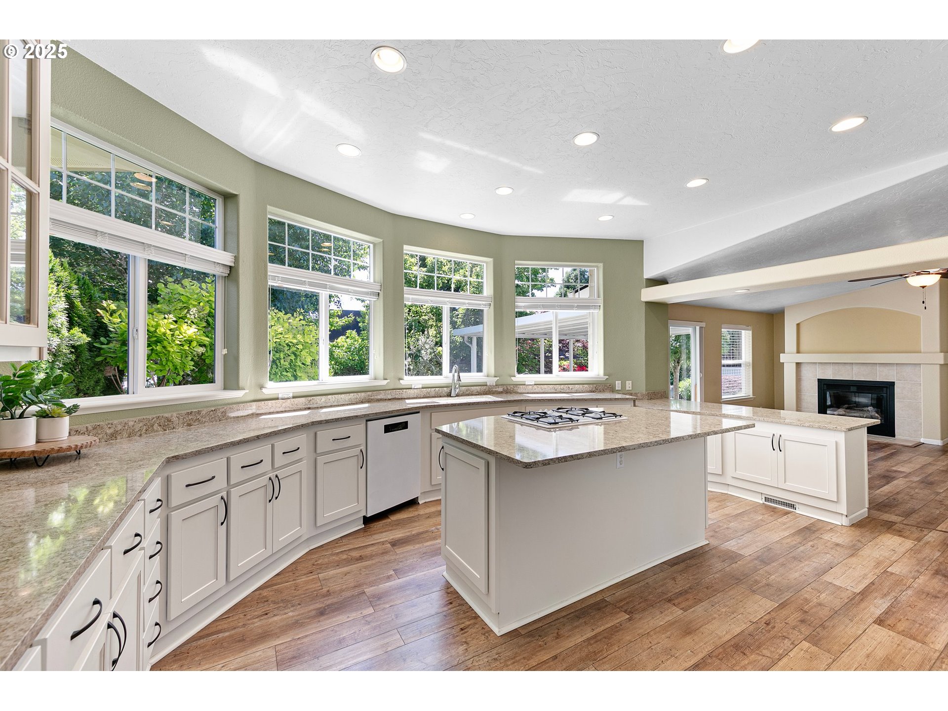 3220 Crescent Avenue, Unit 59 Eugene, OR 97408 - Photo 16 of 43 a large kitchen with kitchen island a sink and a large window