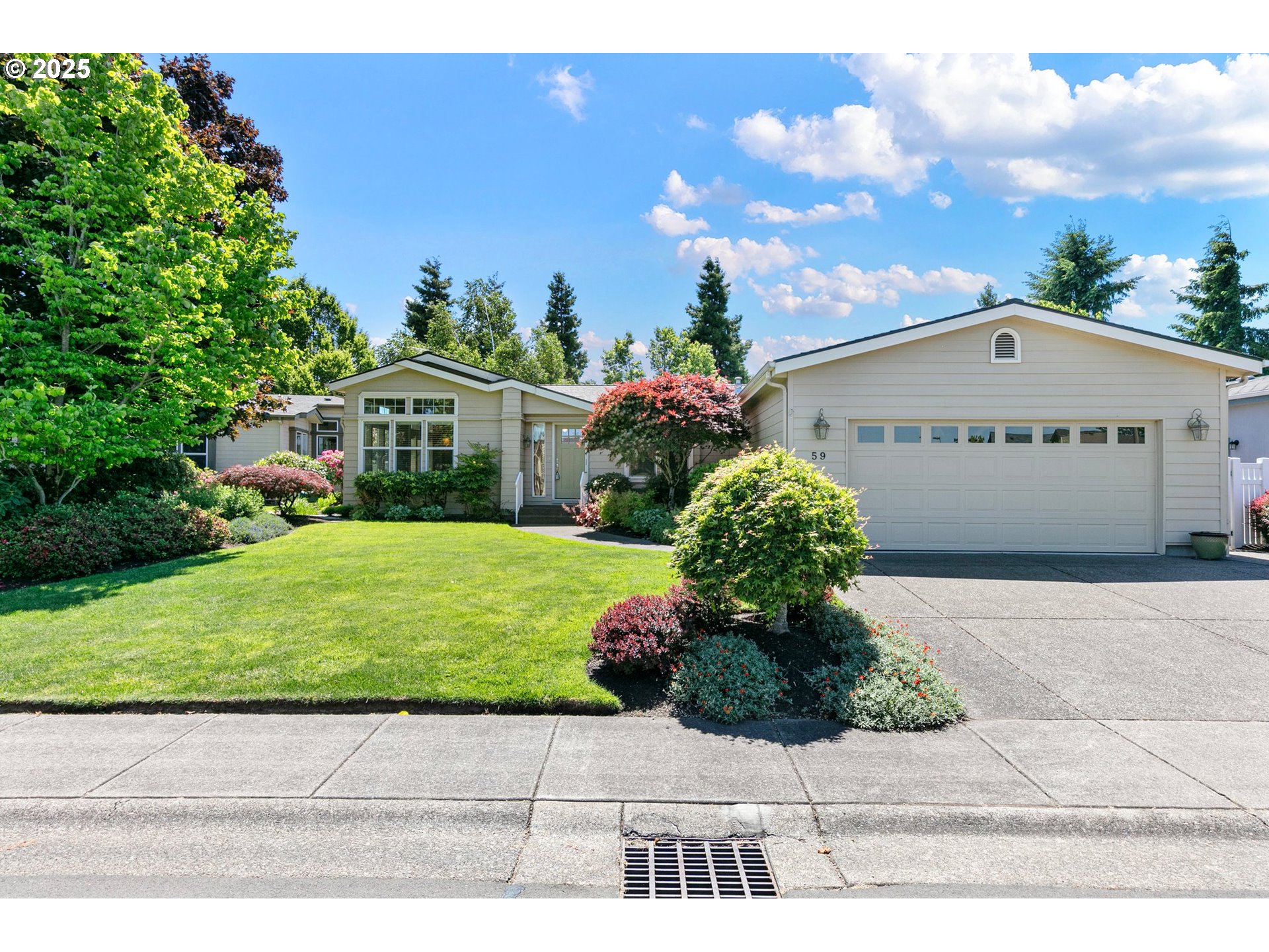 3220 Crescent Avenue, Unit 59 Eugene, OR 97408 - Photo 2 of 43 a front view of a house with a yard and potted plants