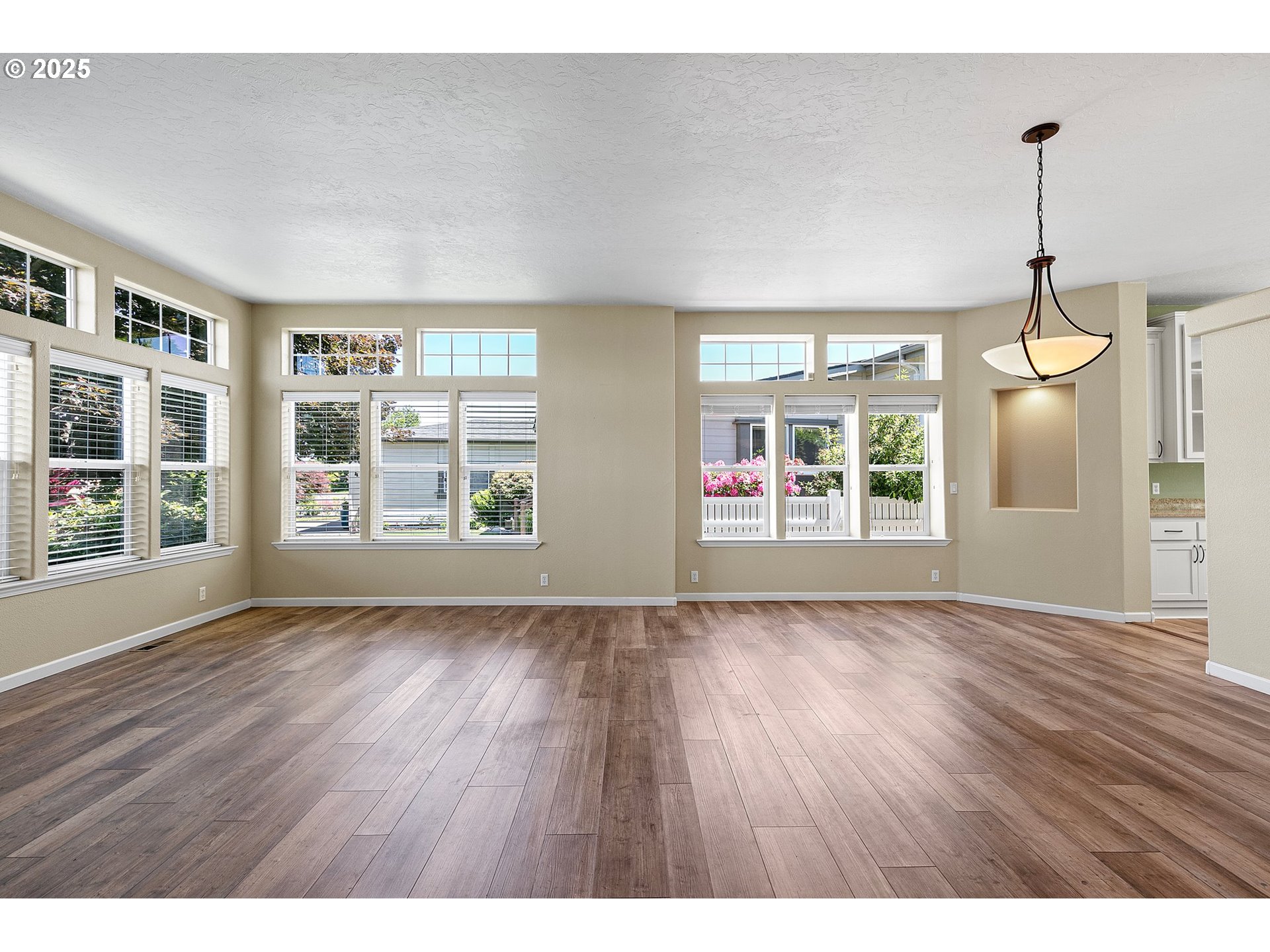 3220 Crescent Avenue, Unit 59 Eugene, OR 97408 - Photo 7 of 43 a view of an empty room with wooden floor and a window