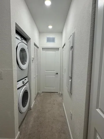 a view of a storage & utility room with washer and dryer