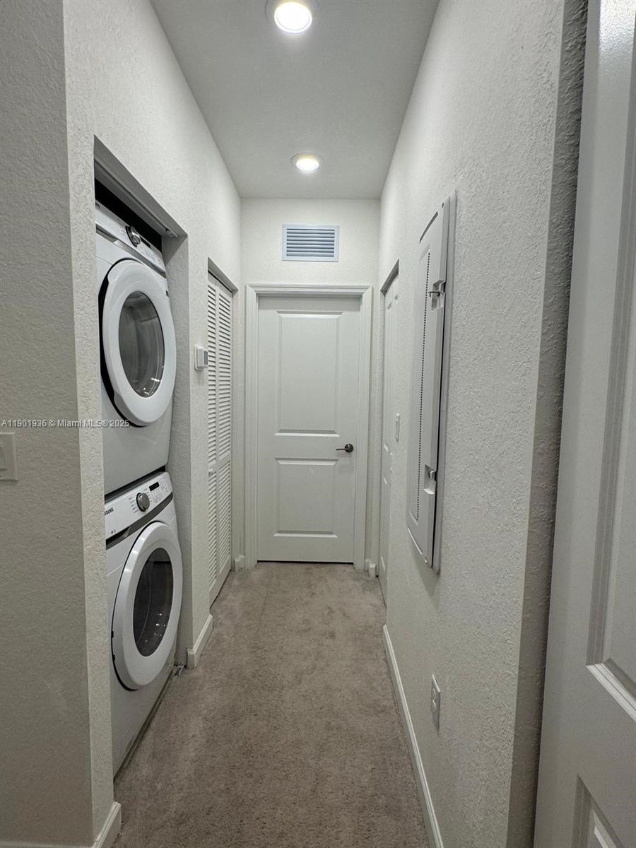 1663 Southeast 26th Street Homestead, FL 33035 - Photo 16 of 22 a view of a storage & utility room with washer and dryer