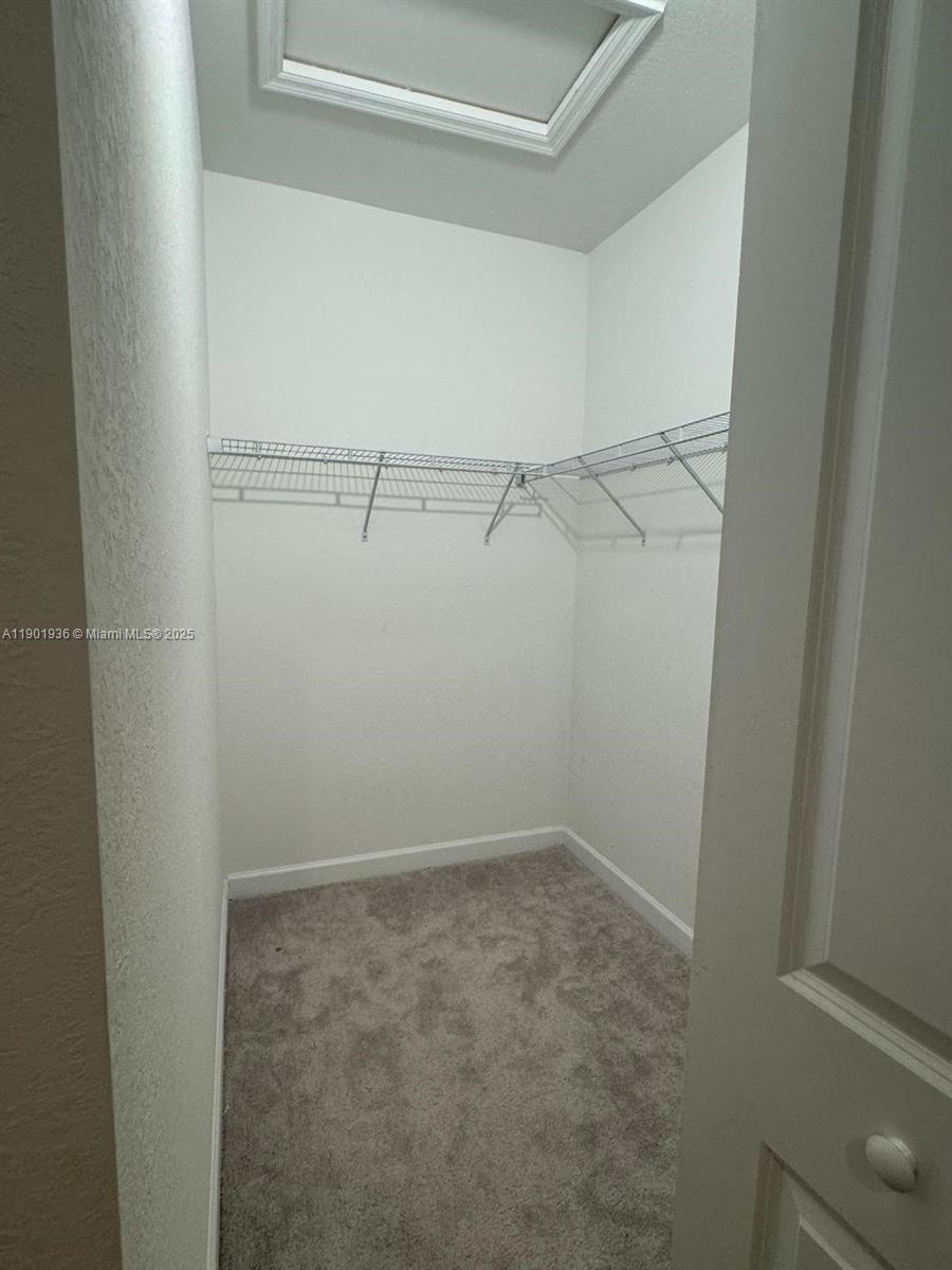 1663 Southeast 26th Street Homestead, FL 33035 - Photo 18 of 22 a view of an empty walk in closet