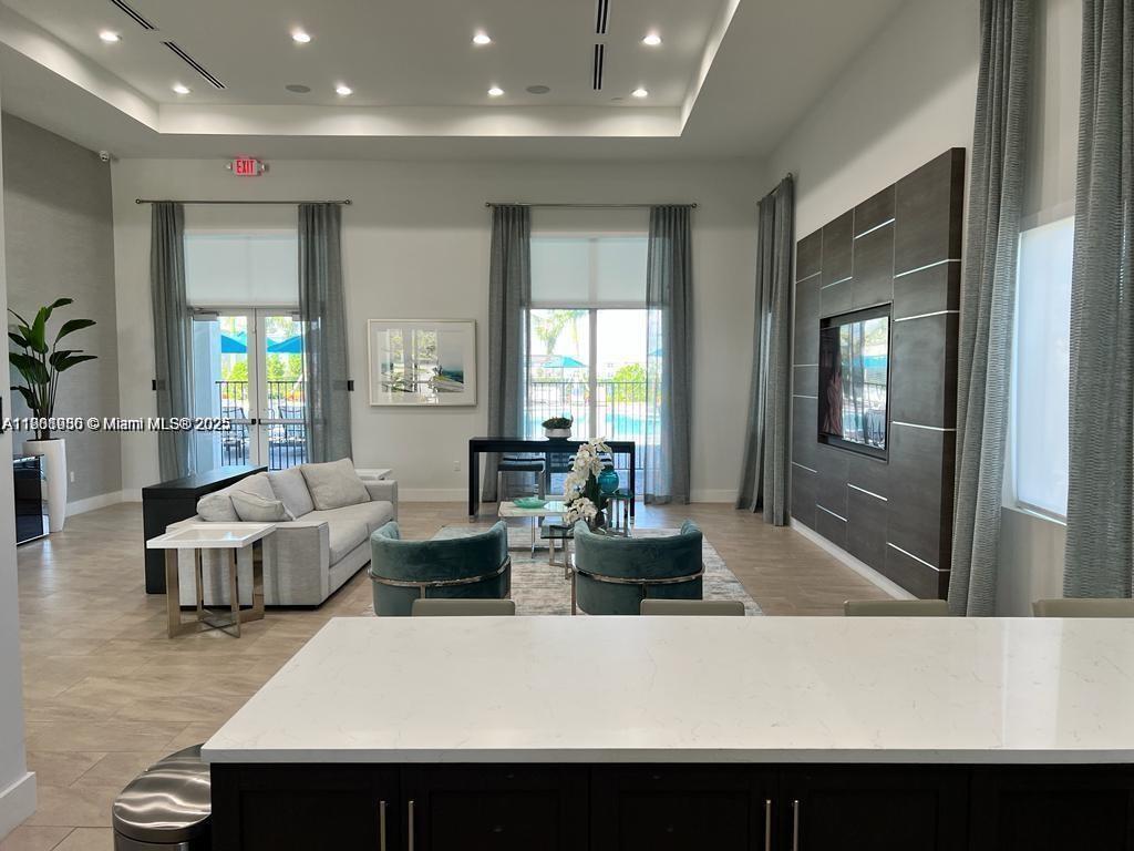 1663 Southeast 26th Street Homestead, FL 33035 - Photo 4 of 22 a living room with fireplace furniture and a potted plant
