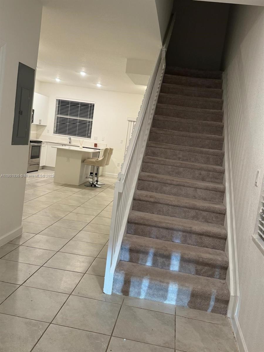 1663 Southeast 26th Street Homestead, FL 33035 - Photo 9 of 22 a view of a living room with furniture and flat screen tv