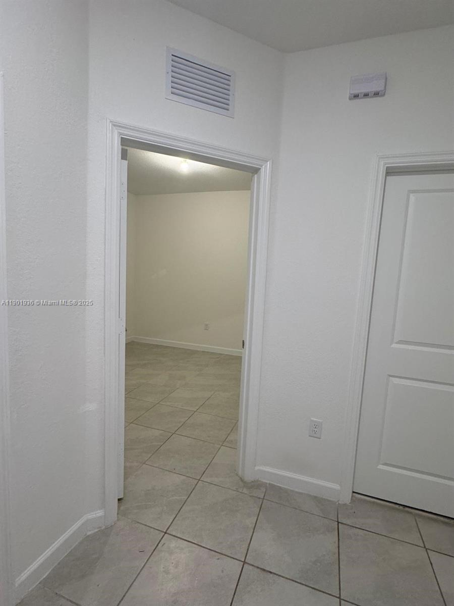 1663 Southeast 26th Street Homestead, FL 33035 - Photo 10 of 22 a view of an empty room