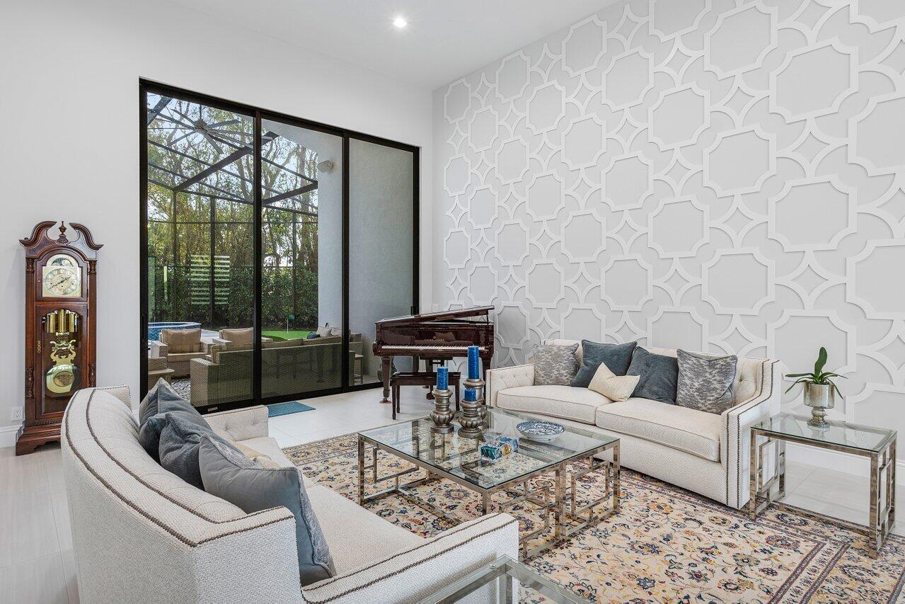 17607 Bocaire Place Boca Raton, FL 33487 - Photo 11 of 62 a living room with furniture and a large window