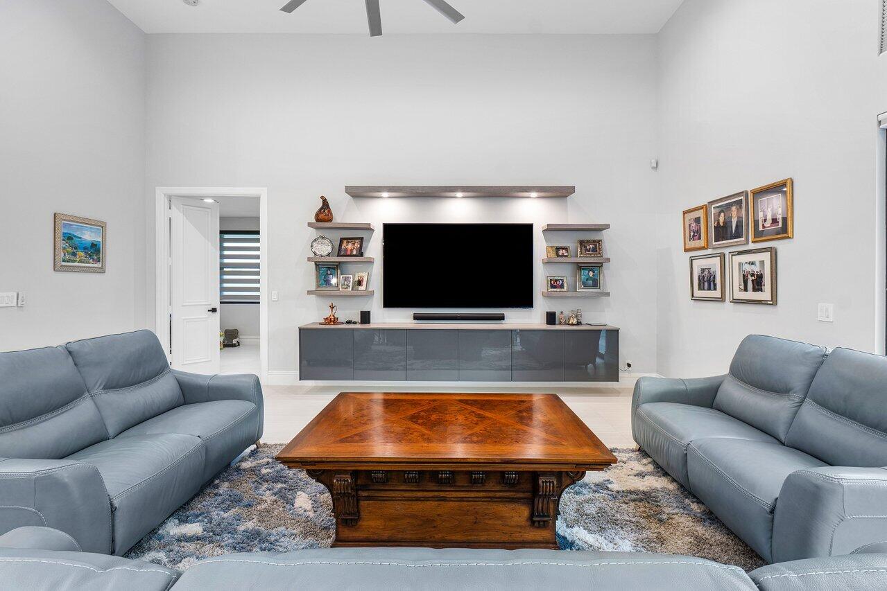 17607 Bocaire Place Boca Raton, FL 33487 - Photo 18 of 62 a living room with furniture and a flat screen tv