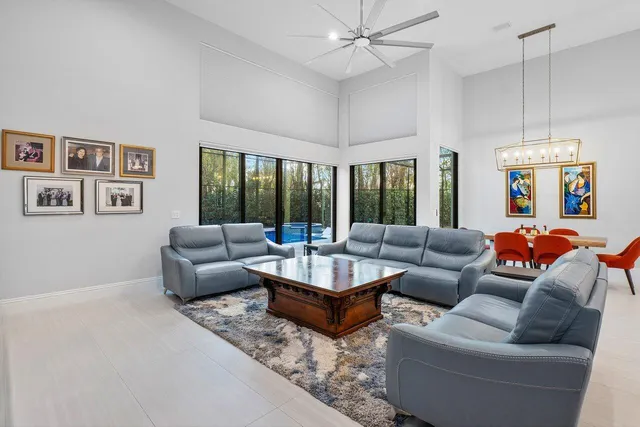 a bedroom with furniture and a flat screen tv