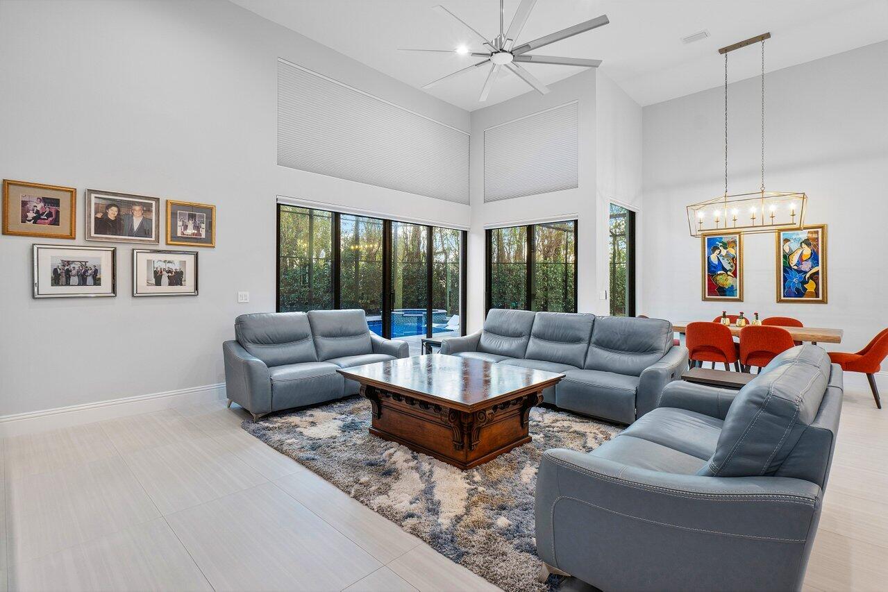 17607 Bocaire Place Boca Raton, FL 33487 - Photo 19 of 62 a living room with furniture and a large window