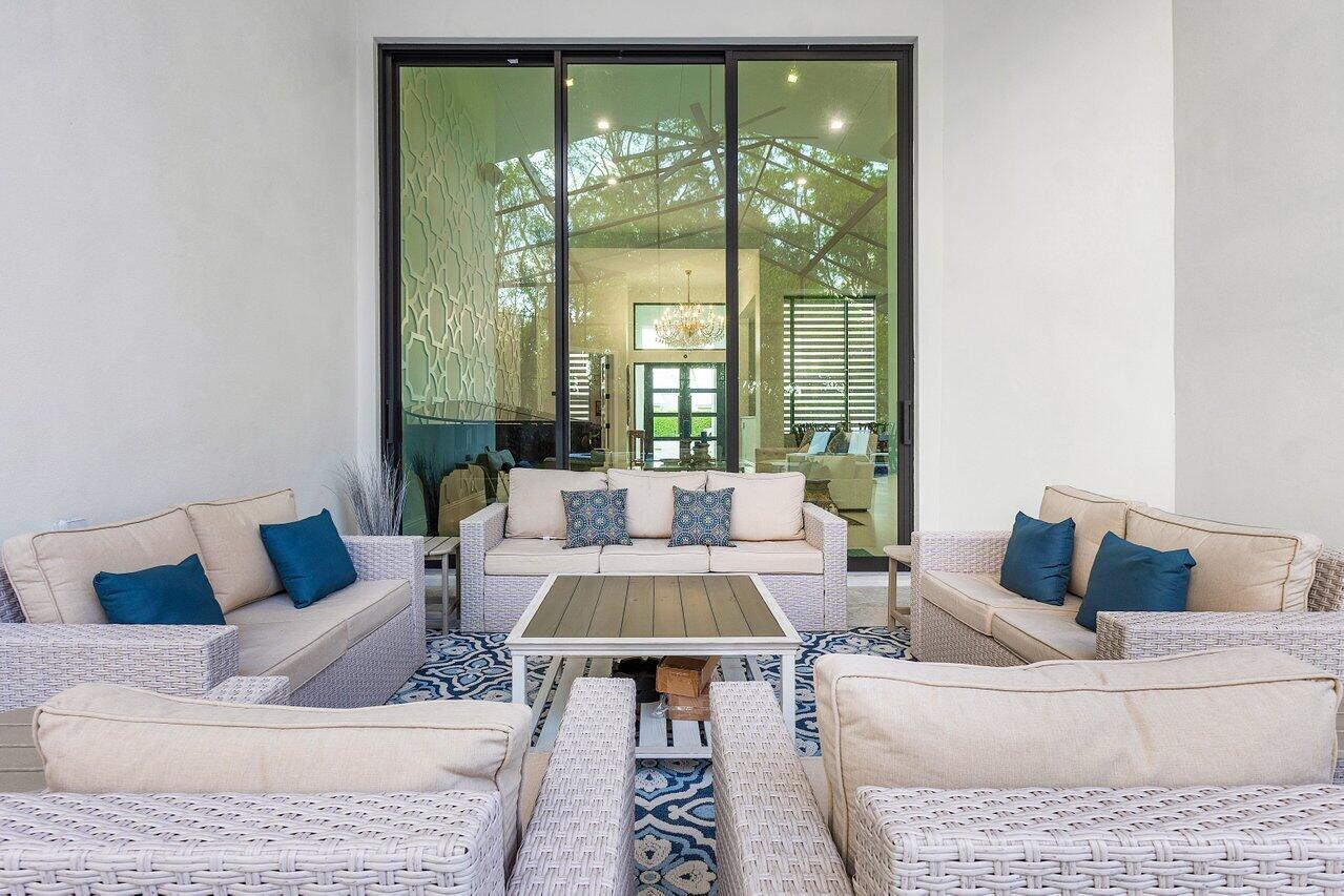 17607 Bocaire Place Boca Raton, FL 33487 - Photo 35 of 62 a living room with furniture and a large window