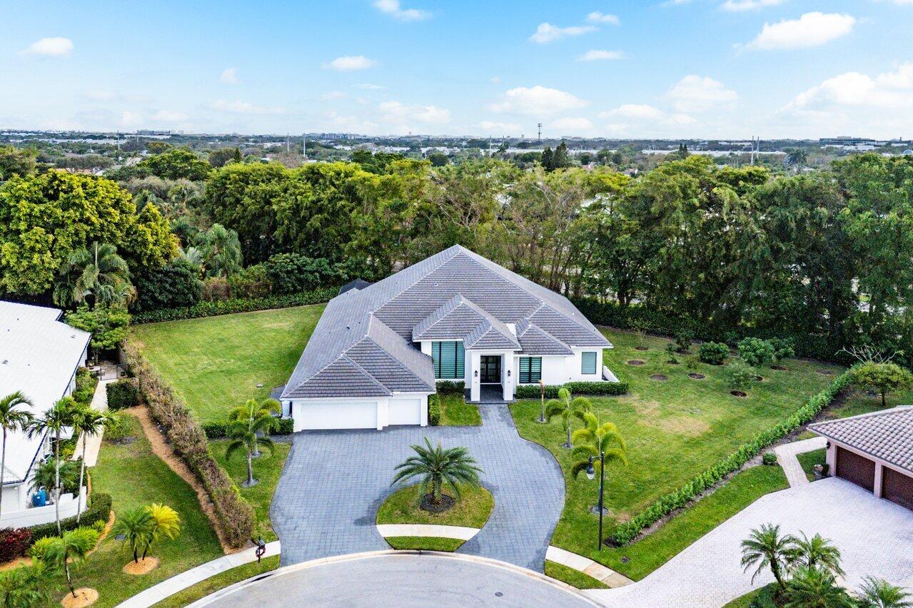 17607 Bocaire Place Boca Raton, FL 33487 - Photo 4 of 62 an aerial view of a house with outdoor space and lake view in back