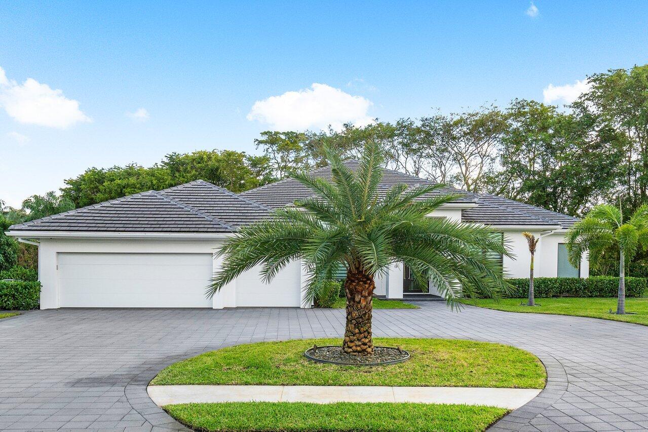 17607 Bocaire Place Boca Raton, FL 33487 - Photo 6 of 62 a front view of a house with a yard