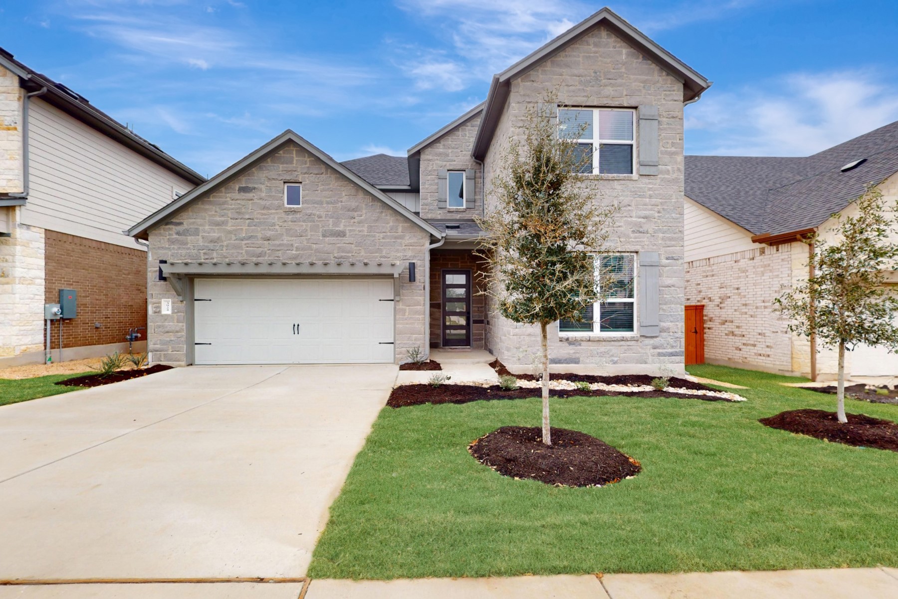 a front view of a house with a yard