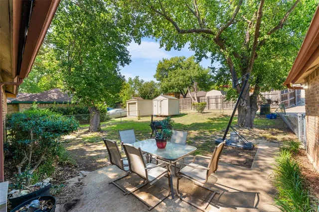 a view of an chairs and table in the patio