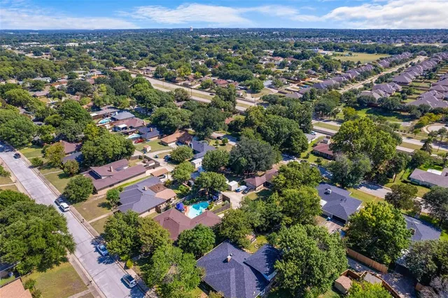 an aerial view of a city with lots of residential buildings