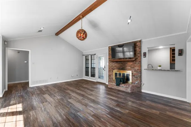 a view of a livingroom with wooden floor