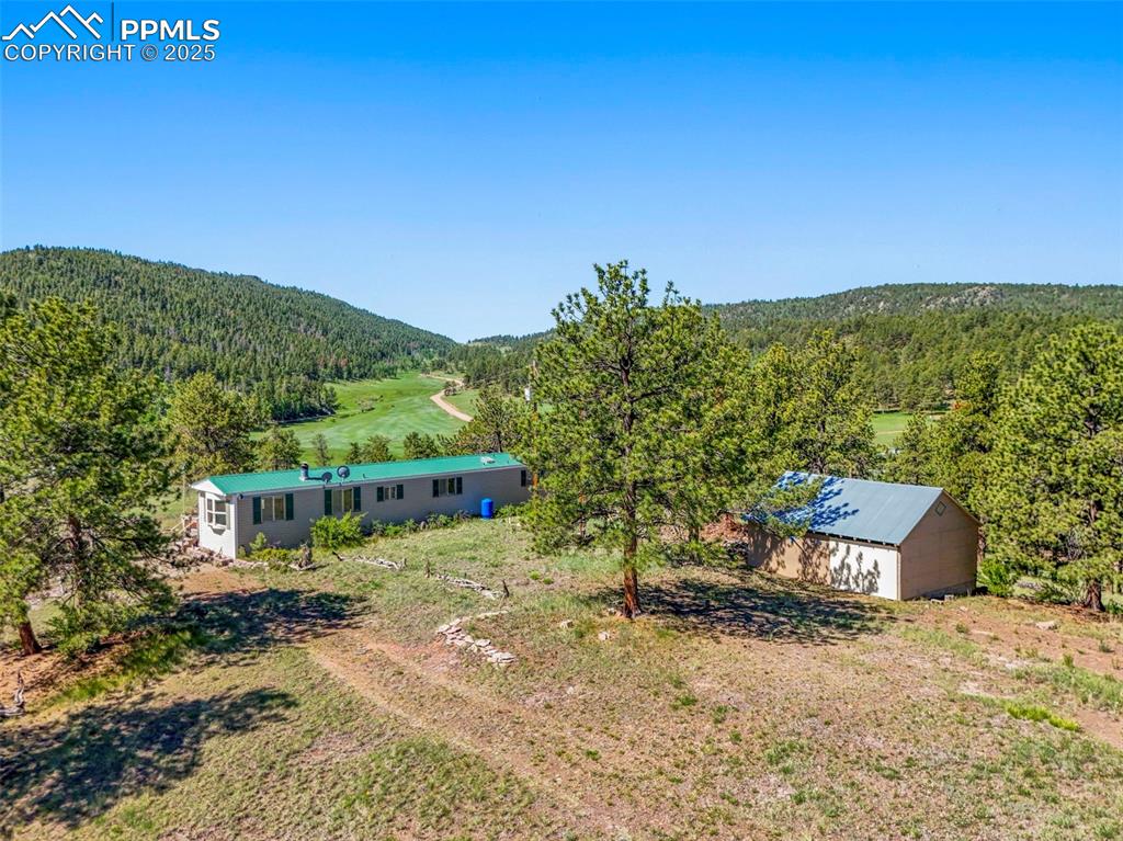 332 Valley Circle Guffey, CO 80820 - Photo 2 of 32 a view of a house with a yard