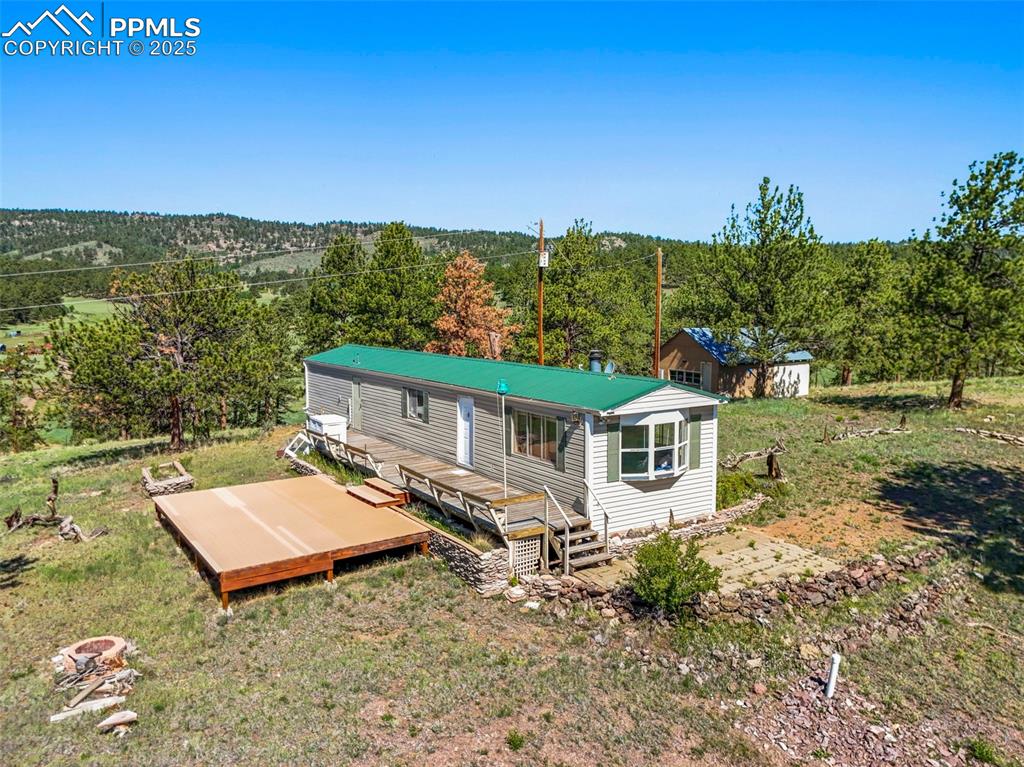 332 Valley Circle Guffey, CO 80820 - Photo 3 of 32 an aerial view of a house with a yard