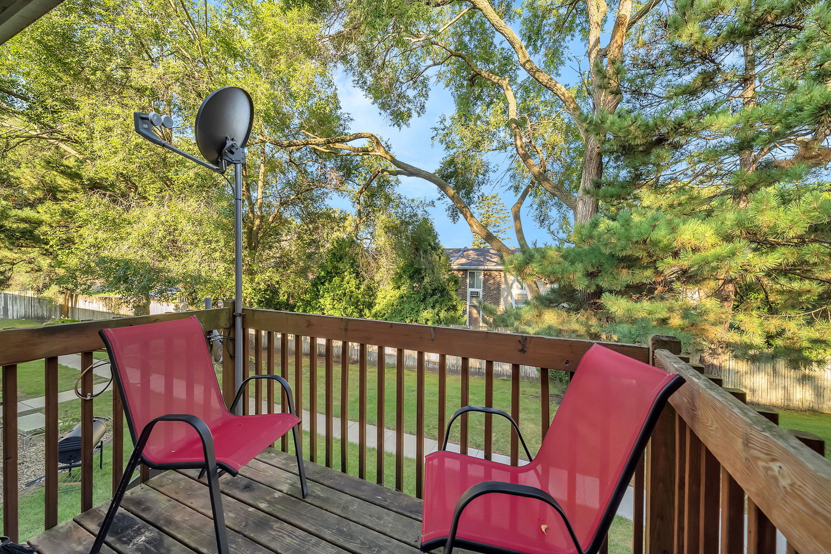 1900 Light Road, Unit 202 Oswego, IL 60543 - Photo 12 of 15 a view of a roof deck with table and chairs