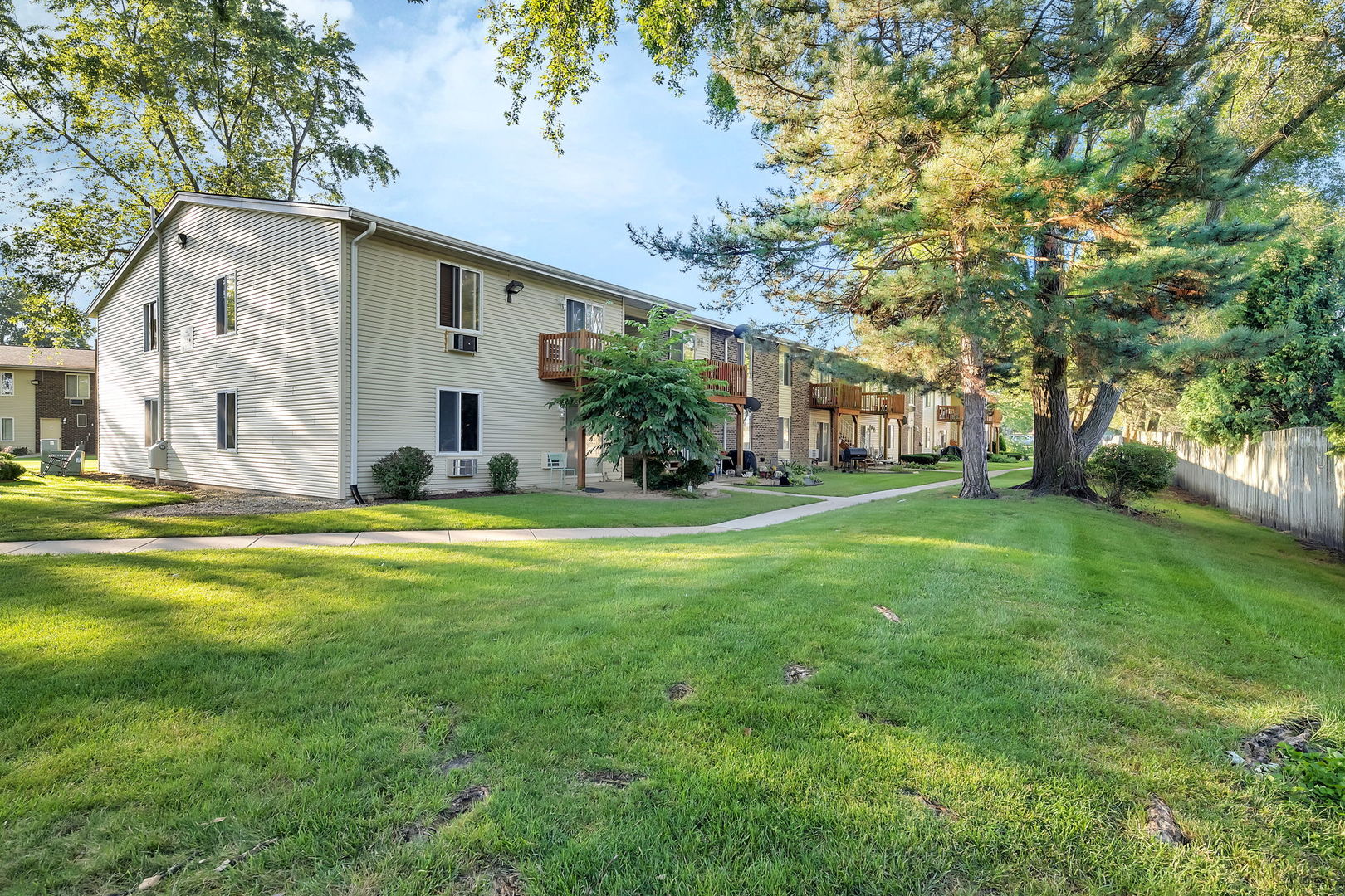 1900 Light Road, Unit 202 Oswego, IL 60543 - Photo 13 of 15 a view of a house with a big yard