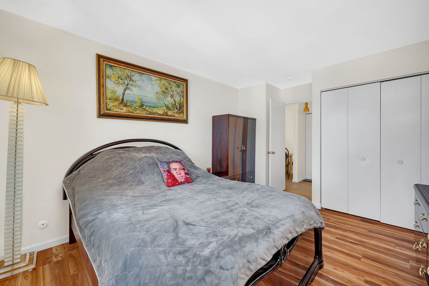 1900 Light Road, Unit 202 Oswego, IL 60543 - Photo 9 of 15 a bedroom with a bed and a chandelier