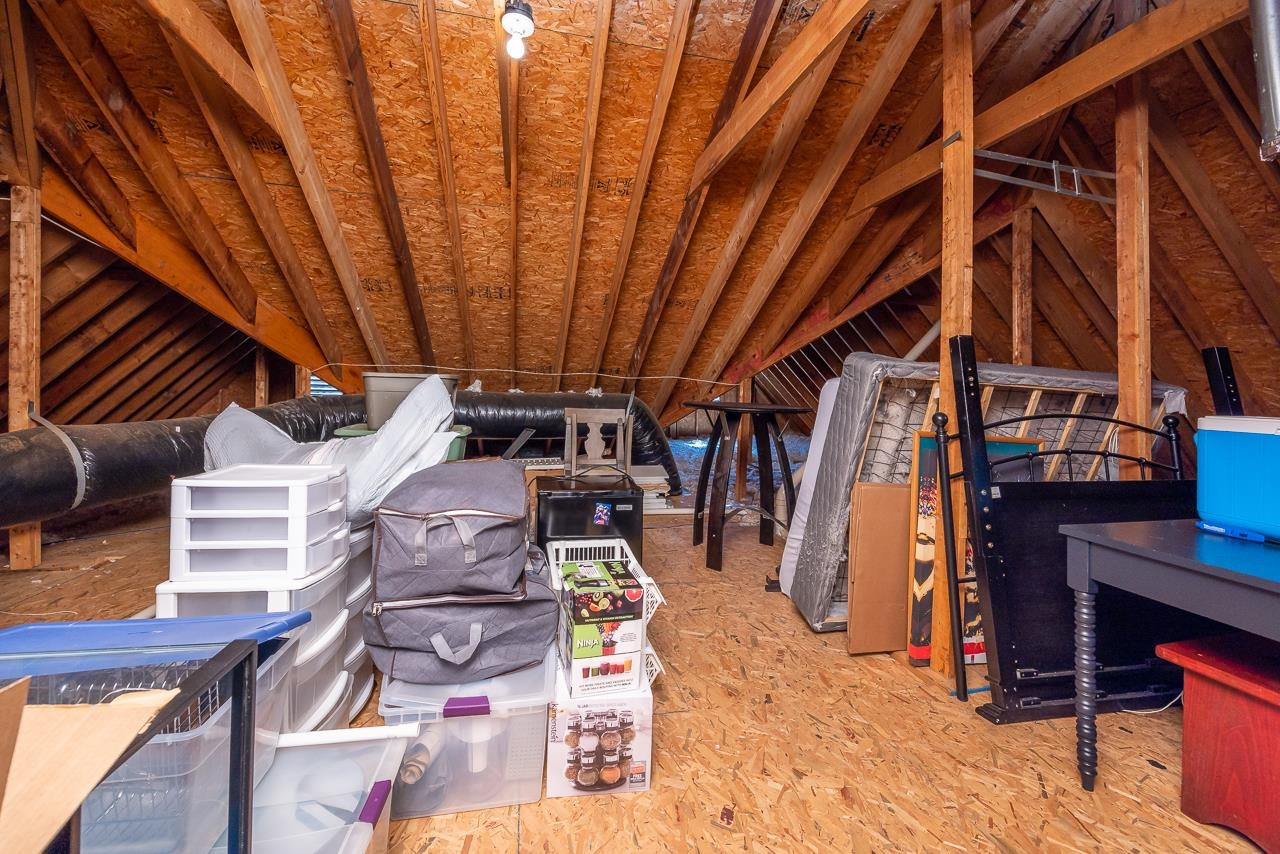 3948 Bentley Bridge Road Raleigh, NC 27612 - Photo 23 of 27 Bonus room steps lead to walk up attic with fantastic options for storage and future square footage! Attic