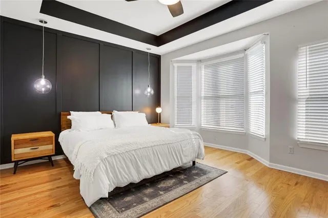 a bedroom with bed and window